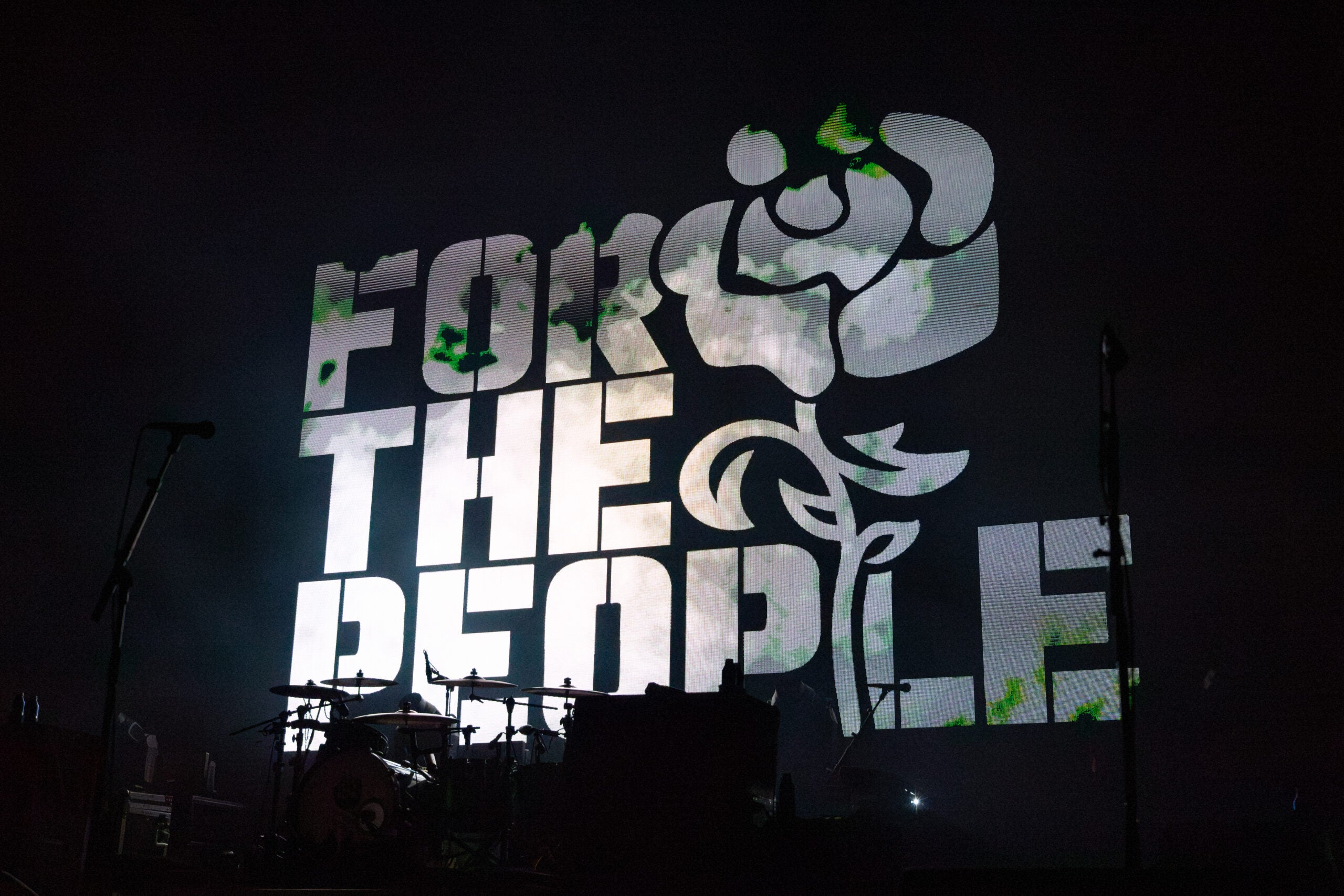 A sign reading "For the People" is displayed during Dropkick Murphys' show Friday night.