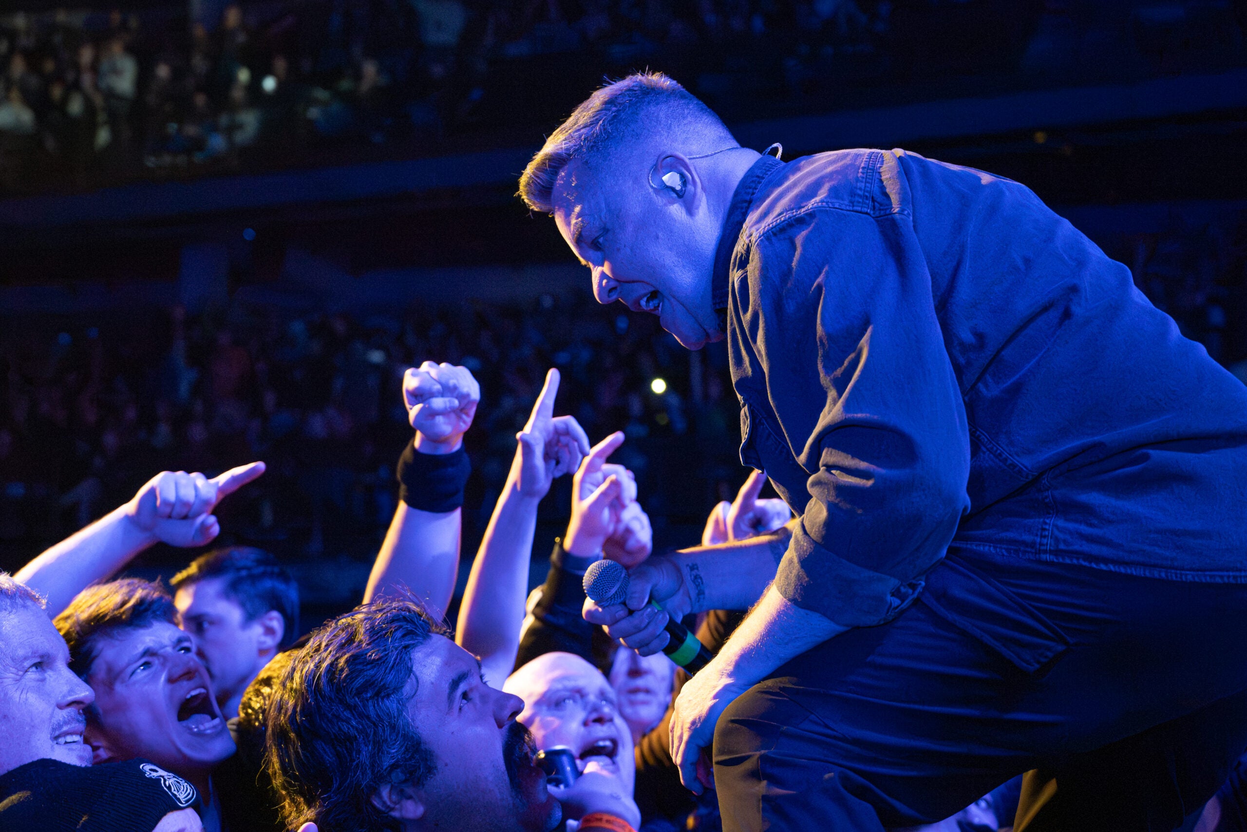 Ken Casey leans in to sing with fans during Dropkick Murphys' Friday night show.