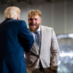 President Donald Trump greets Jake Paul.