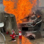 N.H. Gov. Kelly Ayotte and a state trooper helped rescue a Mass. driver from a flaming wreck Tuesday.