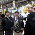 and other players meet Boston Bruins goalie Jeremy Swayman after the state champs from Rhode Island were invited to Bruins practice at Warrior Arena in Brighton on Monday, March 23, 2026.