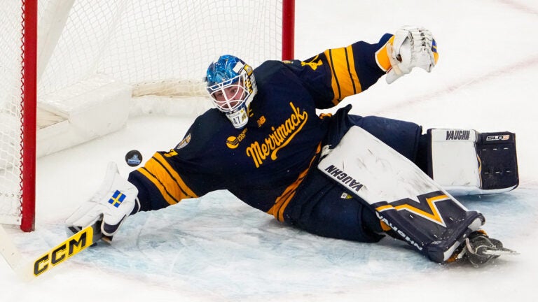 Warriors goaltender Max Lundgren (47) bakes a highlight save on this scoring opportunity by UMass Minutemen forward Jack Musa (9) late in the second period. The UMass Minutemen play the Merrimack Warriors in a Hockey East semi-final game Friday, March 20, 2026 at TD Garden in Boston, MA.