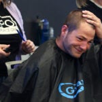 Patriots QB Drake Maye, had his head shaved by hair stylist Katherine Coughlin at Granite’s Saving by Shaving event benefiting Boston Children’s Hospital. They are photographed in QUINCY ,MA on Tuesday March 31 , 2026.
