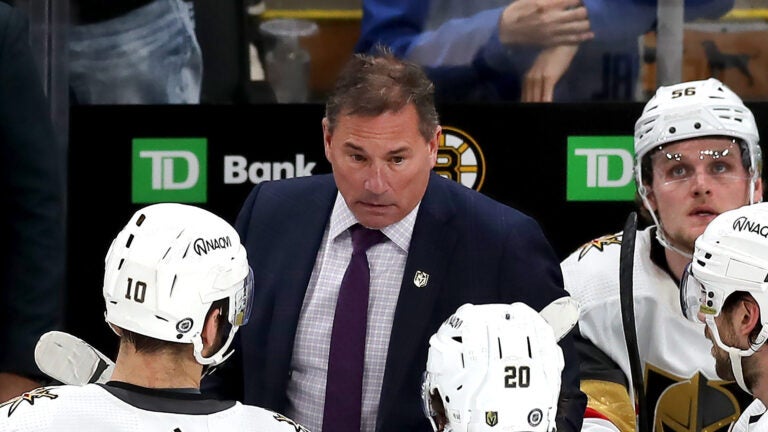 Knights coach Bruce Cassidy instructs his players late in the 3rd period during a timeout with the Bruins ahead, 5-4.