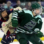 Fleet team captain Megan Keller, right, battles Montreal’s Abby Roque during the second period of the season opener at Tsongas Center on Sunday, November 23, 2025.