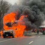 The truck went up in flames early Thursday morning on the Massachusetts Turnpike.