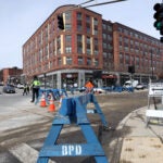 Roadways at the Jackson Square intersection had to be restored after a water main break caused extensive flooding.