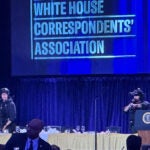 U.S. Secret Service agents respond on stage.