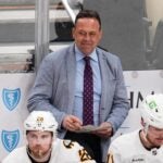 Boston Bruins head coach Marco Sturm stands behind his bench during overtime of an NHL hockey game against the Pittsburgh Penguins in Pittsburgh, Sunday, March 8, 2026.