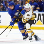 Buffalo Sabres center Tage Thompson (72) and Boston Bruins center James Hagens (44) battle for position during the first period in Game 1 of a first-round NHL hockey Stanley Cup playoff series Sunday, April 19, 2026, in Buffalo, N.Y.