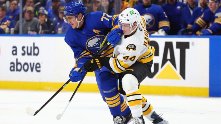 Buffalo Sabres center Tage Thompson (72) and Boston Bruins center James Hagens (44) battle for position during the first period in Game 1 of a first-round NHL hockey Stanley Cup playoff series Sunday, April 19, 2026, in Buffalo, N.Y.