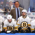 Boston Bruins head coach Marco Strum looks on during the third period in Game 1 of a first-round NHL hockey Stanley Cup playoff series against the Buffalo Sabres Sunday, April 19, 2026, in Buffalo, N.Y.