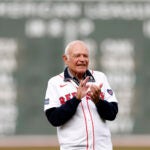 Longtime radio announcer Joe Castiglione is honored with a ceremony on the field before the Boston Red Sox’s final game of the season at Fenway Park.