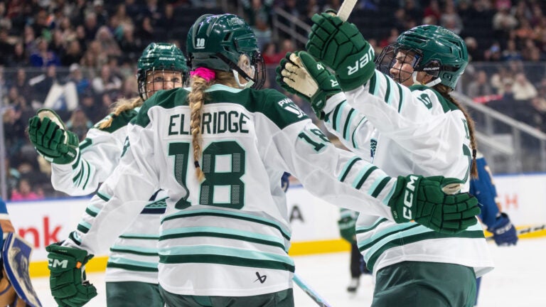 Boston Fleet's Shay Maloney (left), Jessie Eldridge (18) and Sophie Shirley (9) celebrate a goal against the Vancouver Goldeneyes during second period PWHL hockey action in Edmonton on Tuesday, April 7, 2026.