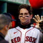 Boston Red Sox right fielder Roman Anthony (19) gets high-fives in the dugout after scoring against the Milwaukee Brewers during the first inning at Fenway Park on April 6, 2026 in Boston.