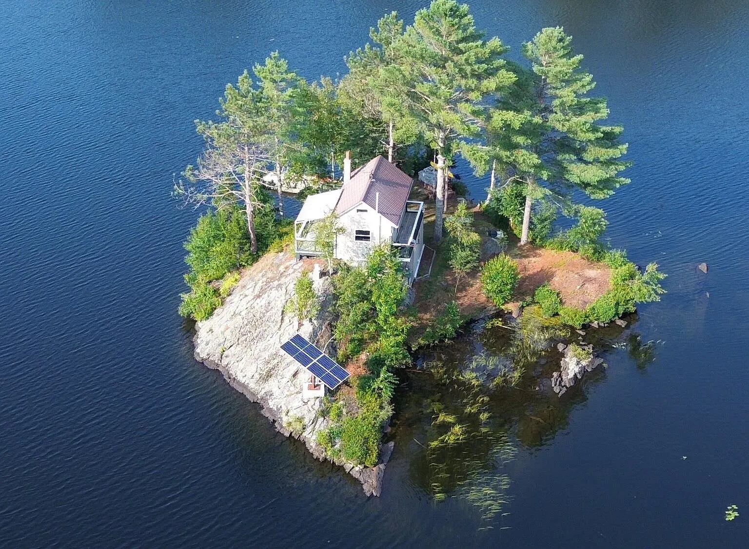 boston.com - Sam Shipman - On a tiny New Hampshire island, a 600-square-foot house for $338k. 'It's fully off the grid.