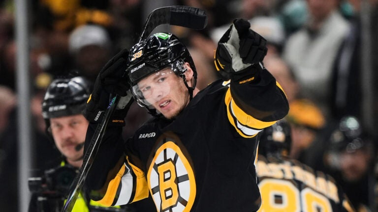 Boston Bruins center Morgan Geekie (39) celebrates his goal during the second period of an NHL hockey game against the Tampa Bay Lightning, Saturday, April 11, 2026, in Boston.
