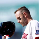 Boston Red Sox shortstop Trevor Story (10) reacts after grounding out resulting in a double play to end the fifth inning during the season home opener against the San Diego Padres at Fenway Park on April 3, 2026 in Boston.