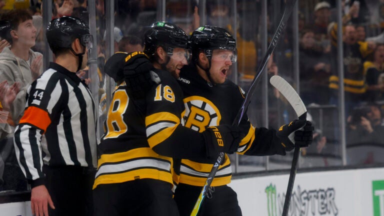 Boston Bruins centers Pavel Zacha (18) and Casey Mittelstadt (11) celebrate a goal against the Pittsburgh Penguins during the first period at TD Garden on March 3, 2026 in Boston.
