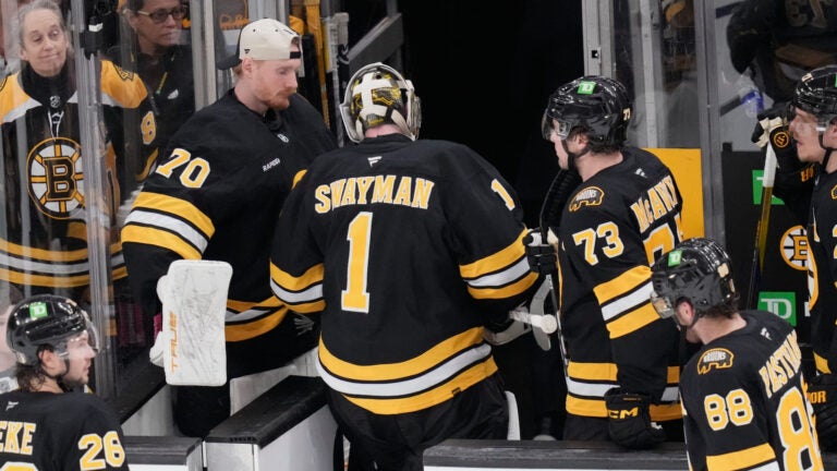 Boston Bruins goaltender Jeremy Swayman (1) heads to the locker room following a loss to the Buffalo Sabres in Game 3 of a first-round NHL hockey Stanley Cup playoff series, Thursday, April 23, 2026, in Boston.