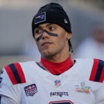 New England Patriots cornerback Christian Gonzalez (0) stands on the sideline before taking on the Seattle Seahawks in the NFL Super Bowl 60 football game, Sunday, Feb. 8, 2026 in Santa Clara, Calif.