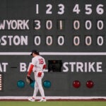 Boston Red Sox left fielder Jarren Duran walks back to his position during the eighth inning of a baseball game against the New York Yankees at Fenway Park, Wednesday, April 22, 2026, in Boston.