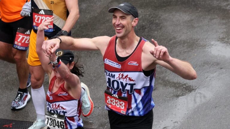 Zdeno Chara crosses the Finish Line of the Boston Marathon in 2023.