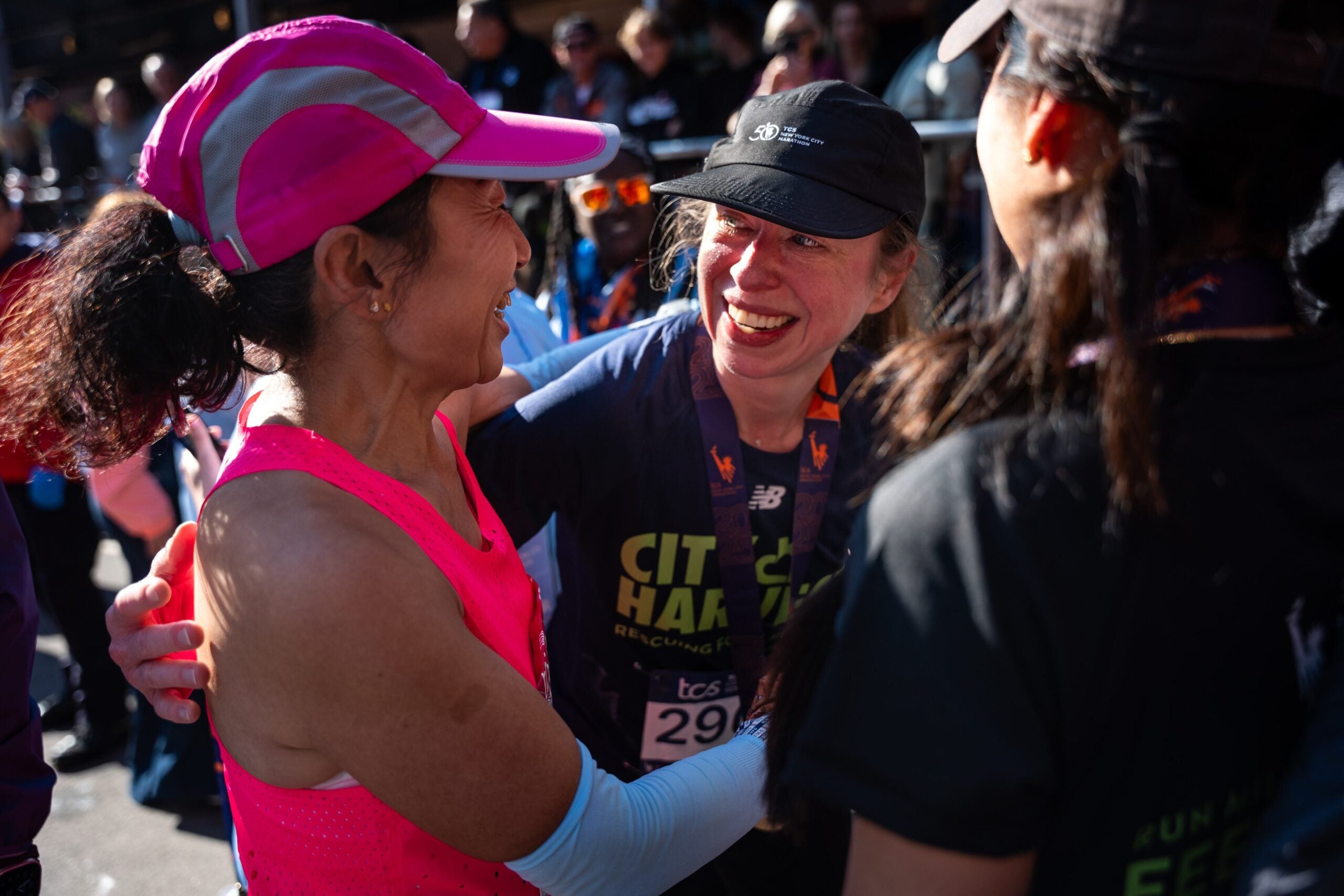 Chelsea Clinton, daughter of former President Bill Clinton, greets a friend after crossing the finish line of the New York City Marathon, Sunday, Nov. 2, 2025, in New York.