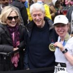 Former U.S. President Bill Clinton, former Secretary of State Hillary Clinton, and Chelsea Clinton pose after Chelsea finished the 130th Boston Marathon on April 20, 2026.
