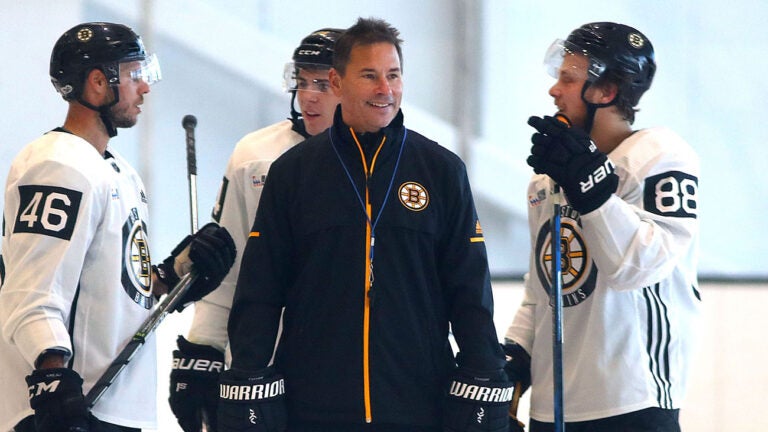 The Bruins held a practice and media day at Warrior Arena as they prepare for their season debut Thursday. Coach Bruce Cassidy smiles as he chats with David Krejci(left) and David Pastrnak.