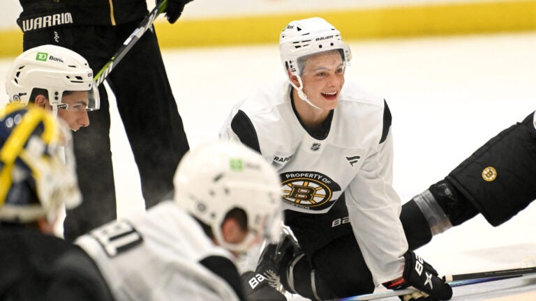 James Hagens, center, a Boston College center and the Bruins’ 7th overall draft pick, stretches with teammates at the conclusion of the first day of Bruins Development Camp at Warrior Arena in Brighton on Monday, June 30, 2025.