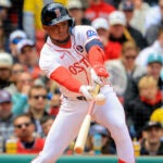 A 4/20/26 Boston Red Sox outfielder Ceddanne Rafaela (3) hits a 2 RBI single and advanced to second base on the throw to the plate against the Detroit Tigers during seventh inning MLB action at Fenway Park on Monday April 20, 2026.