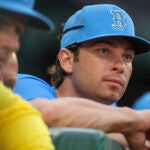 Triston Casas a Boston Red Sox player on the injured reserved list on the top step of his dugout against the Detroit Tigers during eighth inning MLB action at Fenway Park on Saturday September 27, 2025.
