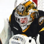 The Boston Bruins vs Tampa Bay Lightning- Bruins golaie Jeremy Swayman makes a stop on a 2nd period Lightning slap shot.