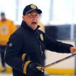 The Boston Bruins held practice at the Warrior Ice Arena on Wednesday. Coach Marco Sturm yells instructions.