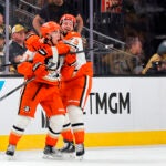 Anaheim Ducks defenseman Olen Zellweger (51) celebrates with center Mason McTavish (23) after scoring against the Vegas Golden Knights during the third period in Game 5 of a second-round NHL hockey Stanley Cup playoff series Tuesday, May 12, 2026, in Las Vegas.