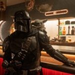 Mandalorian (Pedro Pascal) and Grogu in "The Mandalorian and Grogu."