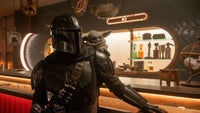 Mandalorian (Pedro Pascal) and Grogu in "The Mandalorian and Grogu."