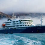 A Boston travel influencer shared his experience aboard the MV Hondius, which is currently facing a suspected hantavirus outbreak.
