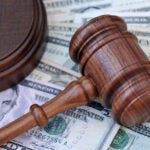 Two men pleaded guilty Friday to charges of bank fraud, conspiracy to commit bank fraud, and conspiracy to commit money laundering.