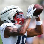 Patriots Kyle Williams catches a pass as the New England Patriots held training camp at the Gillette Stadium complex on Saturday.