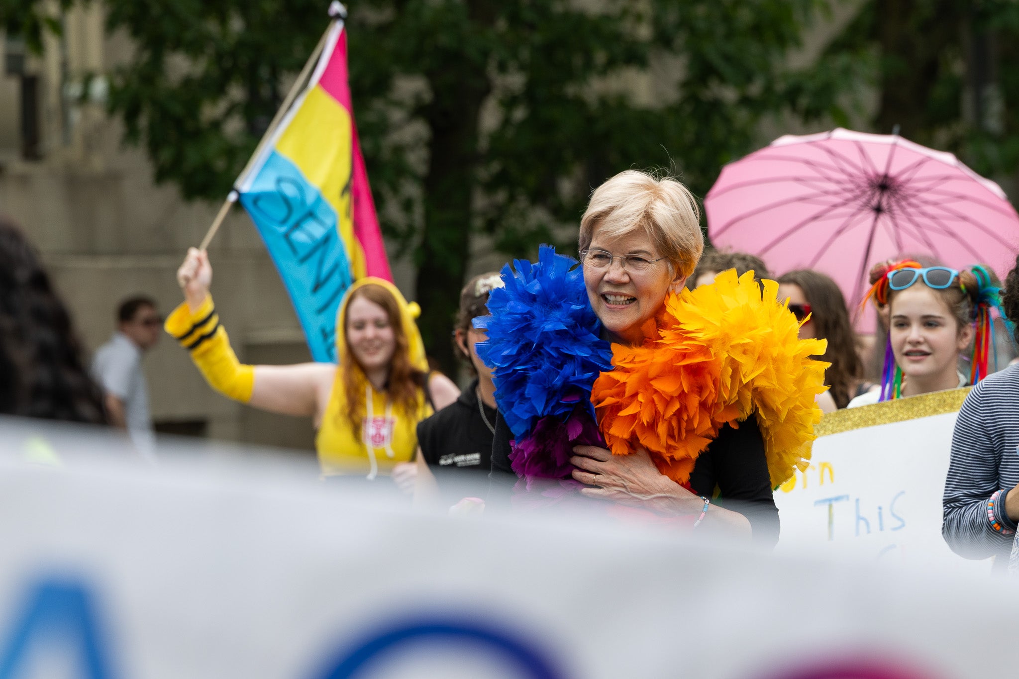 Senator Elizabeth Warren walks alongside thousands of people marching from Copley Square to the Boston Common.
