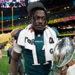 Philadelphia Eagles wide receiver A.J. Brown carries the Vince Lombardi Trophy after the NFL Super Bowl 59 football game against the Kansas City Chiefs, Sunday, Feb. 9, 2025, in New Orleans.