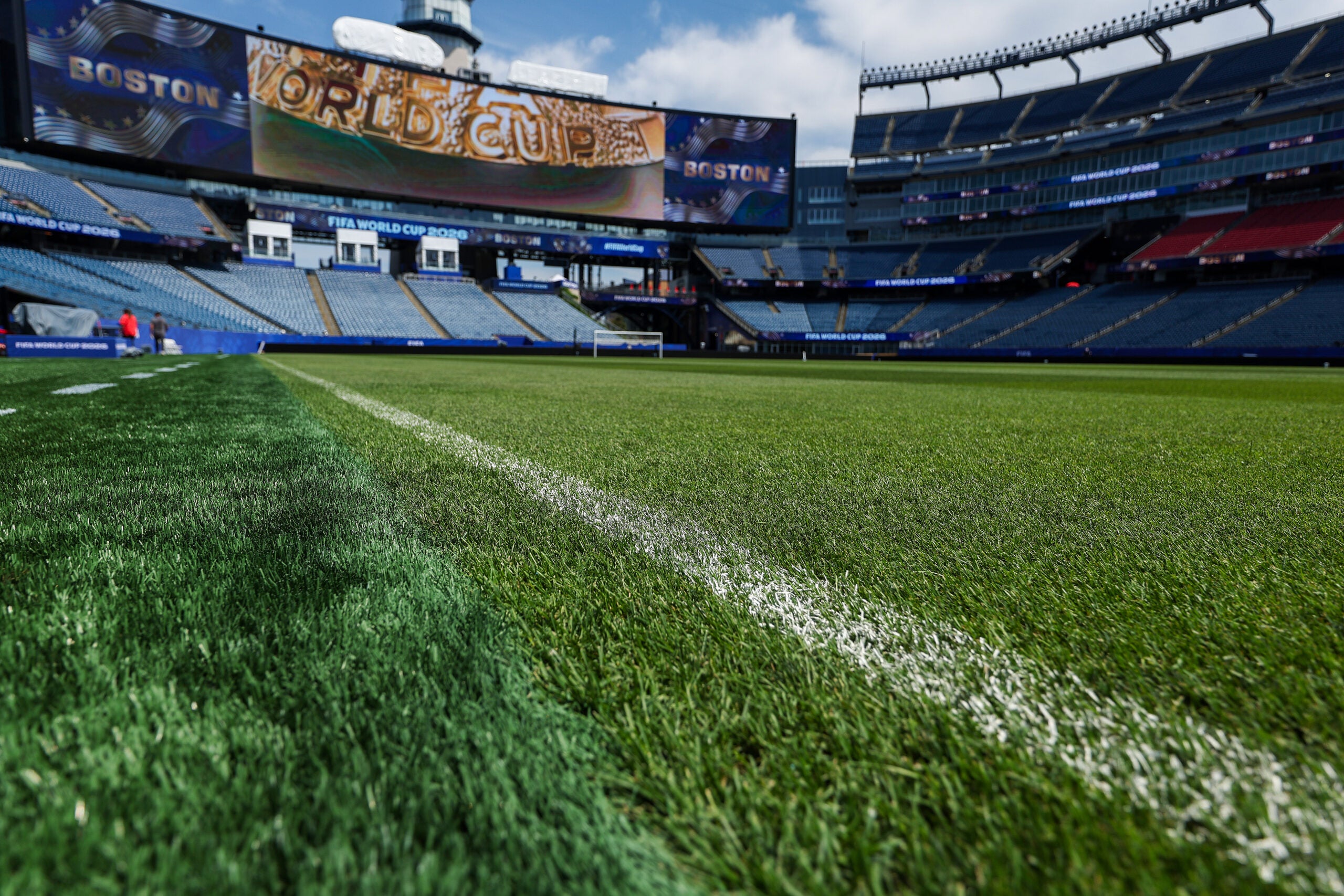 The natural grass on the field has replaced the artificial turf that was on the field before. On the left you can see the artificial turf where it ends before it meets the natural turf. A guided tour of Gillette Stadium before the first World Cup match played there on Saturday. (Photo: Barry Chen/Globe Staff)