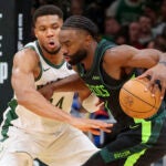 Boston Celtics Jaylen Brown contols his dribble with pressure from Milwaukee Bucks Giannis Anteokounmpo during third quarter NBA action at TD Garden.