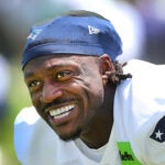 The New England Patriots new wide receiver A.J. Brown smiles during stretching as he took part in his first practice as the Patriots held practice at their practice field at Gillette Stadium Tuesday.