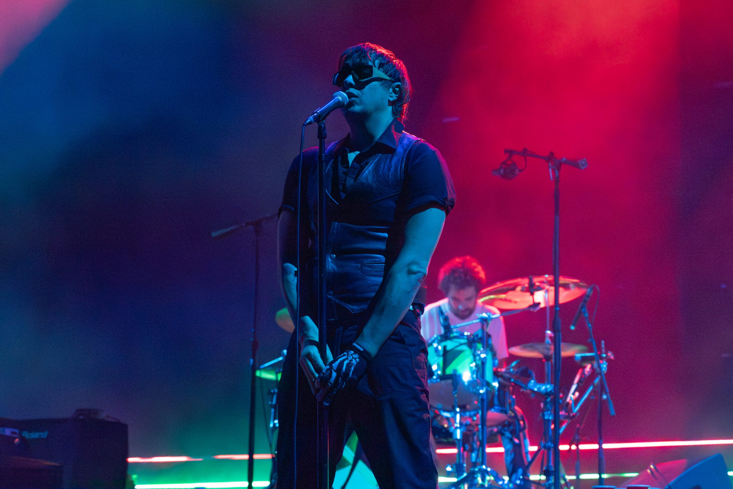 Julian Casablancas sings into the microphone as The Strokes perform "Hard to Explain" at TD Garden.