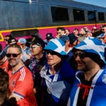 Scottish soccer supporters arrive at Foxborough Station ahead of the 2026 World Cup match between Scotland and Haiti at Boston Stadium.