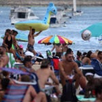 Beachgoers gather at M Street Beach in Boston.
