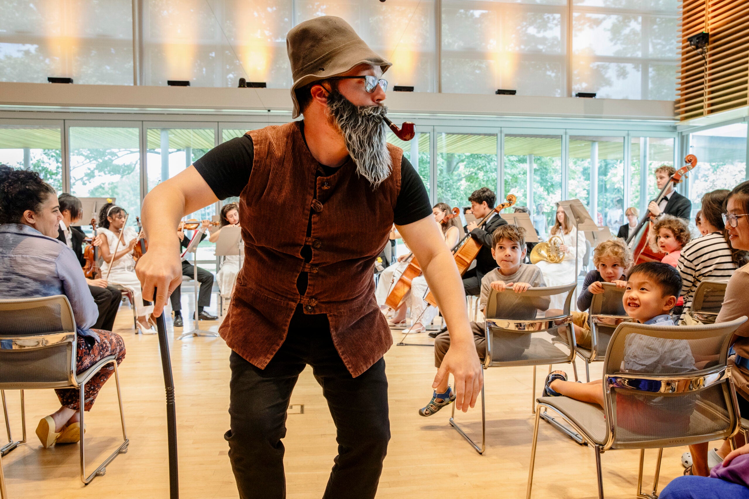 Attendees watch a performer.